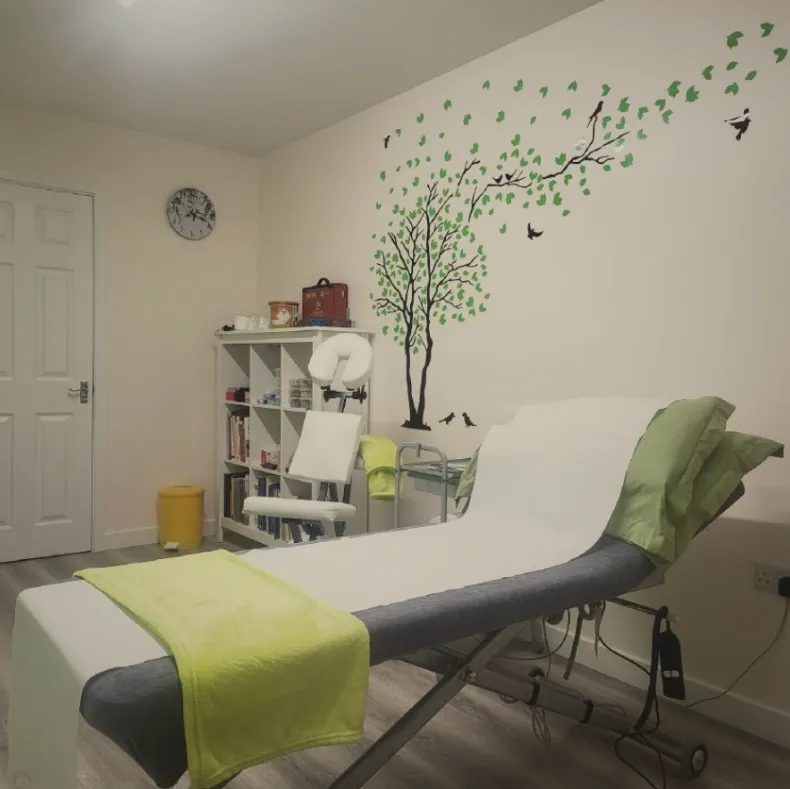 Treatment couch beneath the painted tree